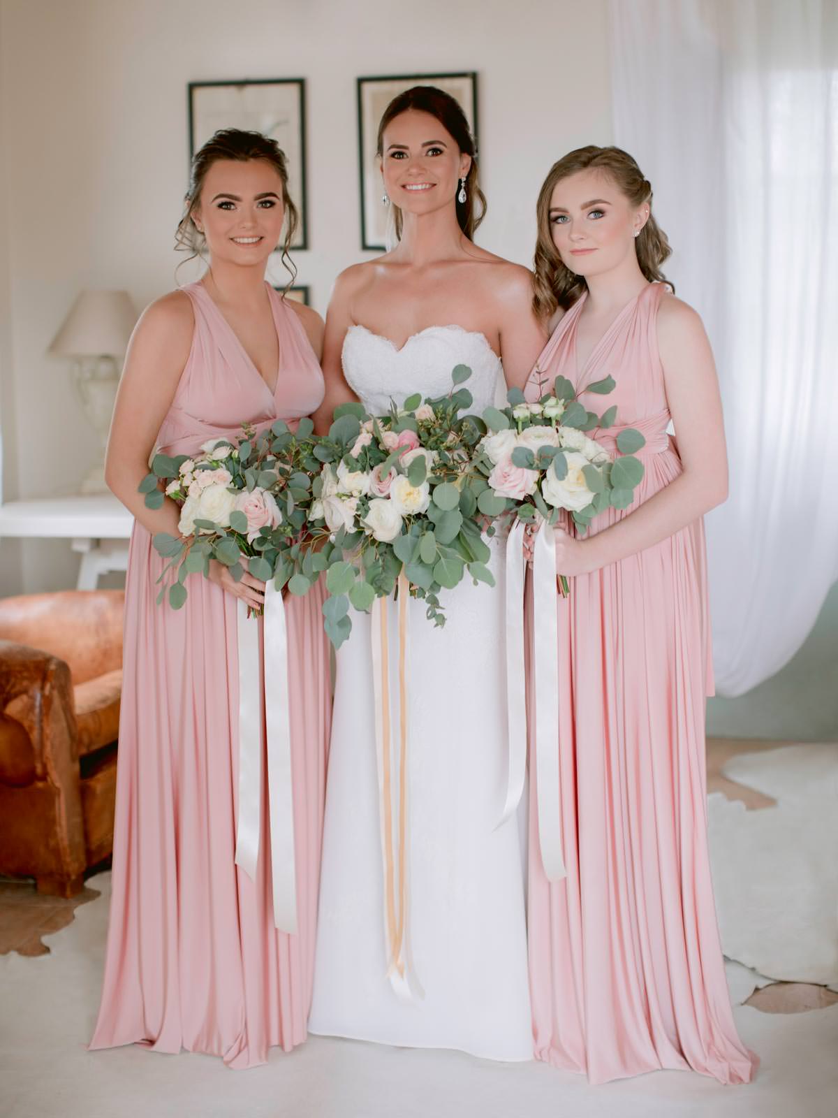 the beautiful bride with her bridesmaids in Tuscany