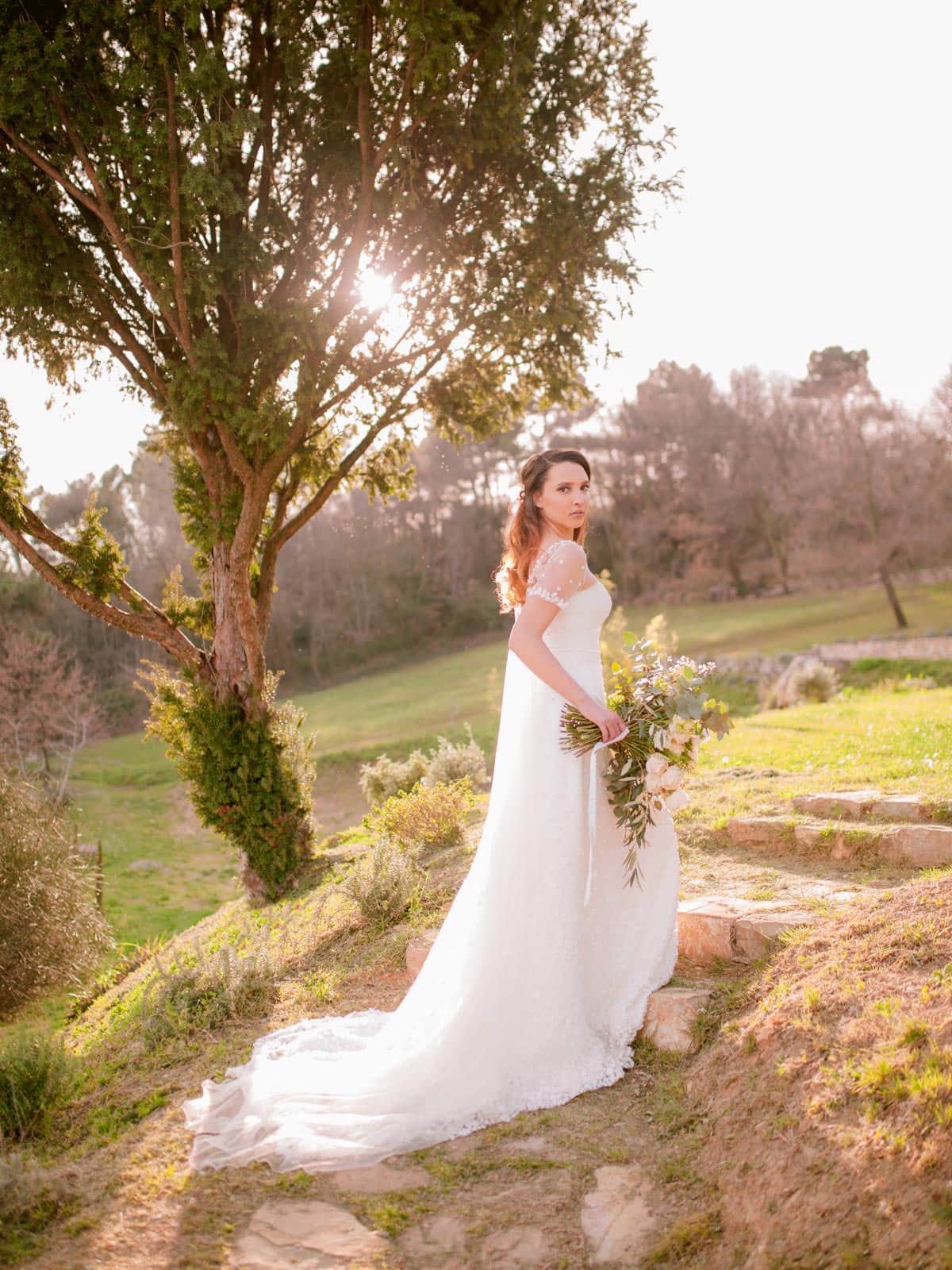 bride is posing during her wedding in Tuscany