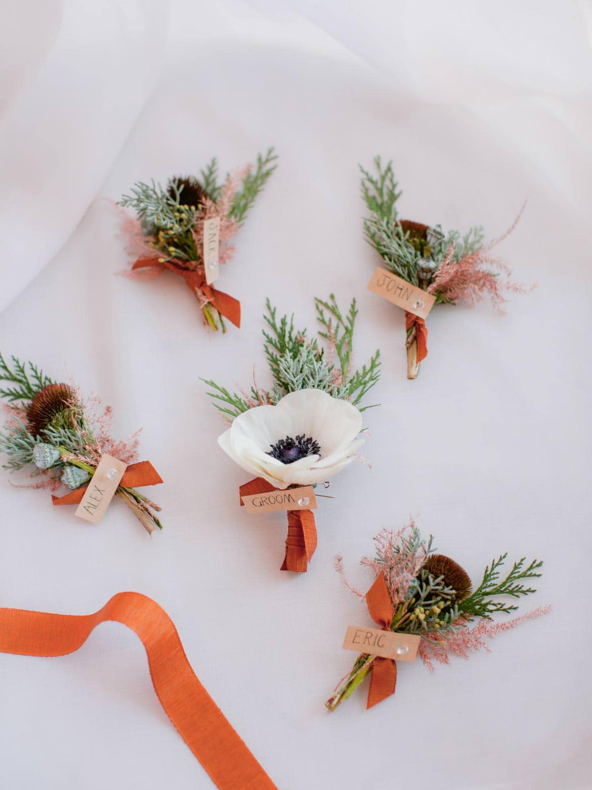 bottonhole flowers fro the groom and his groomsmen