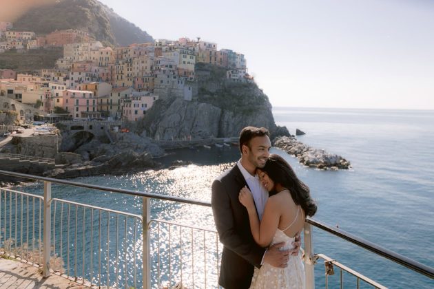 lovers hug each other during their portrait session in manarola